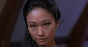 Movie still from “Alice's Restaurant” (1969), directed by Arthur Penn – A woman's face with a serious look on her face; Close Up shot, High angle