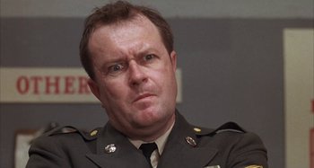 Movie still from “Alice's Restaurant” (1969), directed by Arthur Penn – A person wearing a military uniform; Close Up shot, Low angle