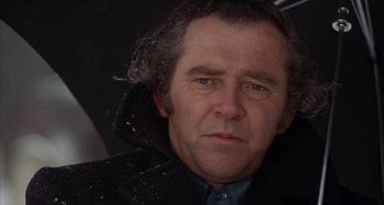 Movie still from “Alice's Restaurant” (1969), directed by Arthur Penn – A person wearing a coat; Close Up shot, Low angle