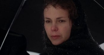Movie still from “Alice's Restaurant” (1969), directed by Arthur Penn – A person wearing a black scarf; Close Up shot, Over the shoulder angle