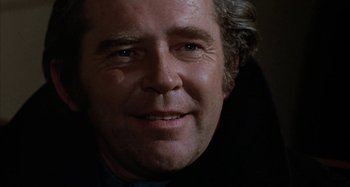 Movie still from “Alice's Restaurant” (1969), directed by Arthur Penn – A man's face in a dark room; Close Up shot, Low angle