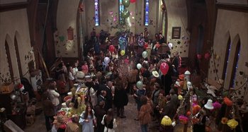 Movie still from “Alice's Restaurant” (1969), directed by Arthur Penn – A group of people gathered in a room with balloons; Wide shot, High angle