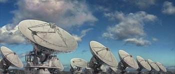 Movie still from “Alien vs. Predator” (2004), directed by Paul W.S. Anderson – A group of satellite dishes sitting on top of a field; Extreme Wide shot, High angle