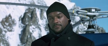 Movie still from “Alien vs. Predator” (2004), directed by Paul W.S. Anderson – A man wearing a black coat and a black hat; Close Up shot, Low angle