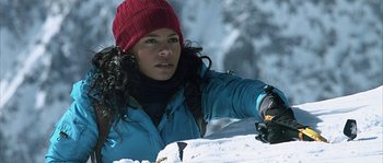 Movie still from “Alien vs. Predator” (2004), directed by Paul W.S. Anderson – A woman in a red hat and blue jacket in the snow; Close Up shot, High angle