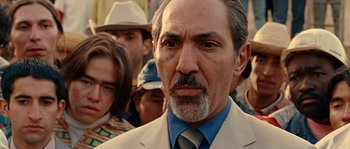 Movie still from “Alien vs. Predator” (2004), directed by Paul W.S. Anderson – An older man in a suit and a tie; Close Up shot, Low angle