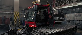 Movie still from “Alien vs. Predator” (2004), directed by Paul W.S. Anderson – A man sitting in the driver's seat of a tractor; Wide shot, High angle