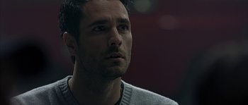 Movie still from “Alien vs. Predator” (2004), directed by Paul W.S. Anderson – A person wearing a sweater; Close Up shot, Over the shoulder angle