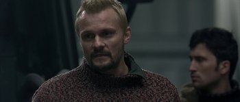 Movie still from “Alien vs. Predator” (2004), directed by Paul W.S. Anderson – A person wearing a sweater; Close Up shot, Over the shoulder angle