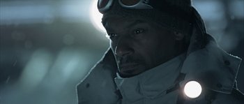 Movie still from “Alien vs. Predator” (2004), directed by Paul W.S. Anderson – A person wearing goggles and a jacket; Close Up shot, Low angle