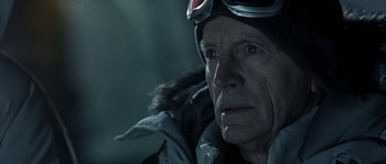 Movie still from “Alien vs. Predator” (2004), directed by Paul W.S. Anderson – An older man wearing a ski jacket and goggles; Close Up shot, Over the shoulder angle