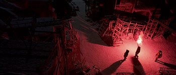 Movie still from “Alien vs. Predator” (2004), directed by Paul W.S. Anderson – A person standing in a room next to a bunch of chairs; Extreme Wide shot, High angle