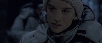 Movie still from “Alien vs. Predator” (2004), directed by Paul W.S. Anderson – A person wearing a jacket and a hat; Close Up shot, Over the shoulder angle