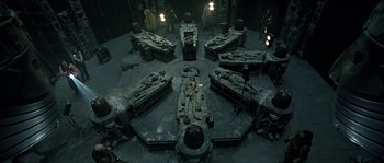 Movie still from “Alien vs. Predator” (2004), directed by Paul W.S. Anderson – A room filled with lots and lots of statues; Wide shot, High angle