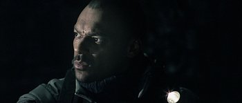 Movie still from “Alien vs. Predator” (2004), directed by Paul W.S. Anderson – A person wearing a jacket; Close Up shot, Low angle