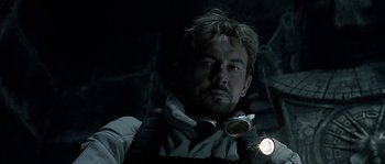 Movie still from “Alien vs. Predator” (2004), directed by Paul W.S. Anderson – A person with a flashlight; Close Up shot, Low angle