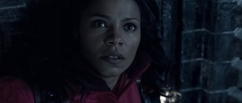 Movie still from “Alien vs. Predator” (2004), directed by Paul W.S. Anderson – A person wearing a red jacket; Close Up shot, High angle
