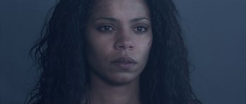 Movie still from “Alien vs. Predator” (2004), directed by Paul W.S. Anderson – A person with long hair; Close Up shot, Low angle