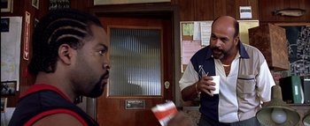 Movie still from “All About the Benjamins” (2002), directed by Kevin Bray – Two men standing in front of each other; Medium shot, Over the shoulder angle