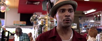 Movie still from “All About the Benjamins” (2002), directed by Kevin Bray – A person wearing a hat; Close Up shot, Low angle