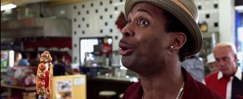 Movie still from “All About the Benjamins” (2002), directed by Kevin Bray – A person wearing a hat; Close Up shot, Over the shoulder angle