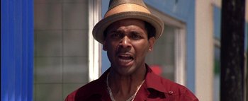 Movie still from “All About the Benjamins” (2002), directed by Kevin Bray – A person wearing a hat; Close Up shot, Low angle