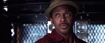 Movie still from “All About the Benjamins” (2002), directed by Kevin Bray – A person wearing a hat; Close Up shot, Low angle