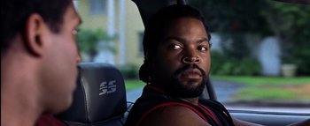 Movie still from “All About the Benjamins” (2002), directed by Kevin Bray – A person sitting in a car; Close Up shot, Over the shoulder angle