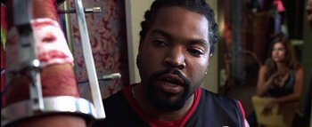 Movie still from “All About the Benjamins” (2002), directed by Kevin Bray – A person with a beard; Close Up shot, Over the shoulder angle