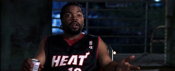 Movie still from “All About the Benjamins” (2002), directed by Kevin Bray – A person wearing a basketball uniform; Close Up shot, Over the shoulder angle