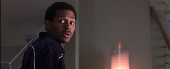 Movie still from “All About the Benjamins” (2002), directed by Kevin Bray – A person looking at the camera; Close Up shot, Low angle