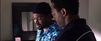 Movie still from “All About the Benjamins” (2002), directed by Kevin Bray – A couple of men standing next to each other; Close Up shot, Over the shoulder angle