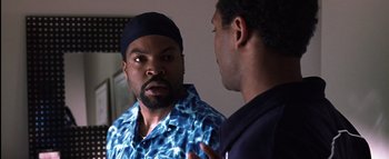 Movie still from “All About the Benjamins” (2002), directed by Kevin Bray – Two men talking to each other in front of a mirror; Close Up shot, Over the shoulder angle