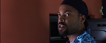 Movie still from “All About the Benjamins” (2002), directed by Kevin Bray – A person with a beard wearing a hat; Close Up shot, Low angle