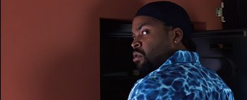 Movie still from “All About the Benjamins” (2002), directed by Kevin Bray – A person with a beard; Close Up shot, Over the shoulder angle