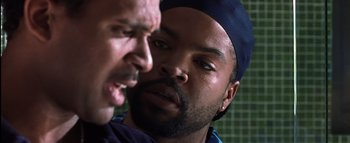 Movie still from “All About the Benjamins” (2002), directed by Kevin Bray – Two men one of whom has his mouth open and the other one has his nose up; Close Up shot, Over the shoulder angle