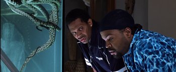 Movie still from “All About the Benjamins” (2002), directed by Kevin Bray – A couple of men standing next to each other in a room; Close Up shot, Low angle