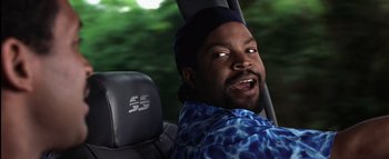 Movie still from “All About the Benjamins” (2002), directed by Kevin Bray – A person sitting in a car; Close Up shot, Low angle