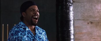 Movie still from “All About the Benjamins” (2002), directed by Kevin Bray – A man in a blue shirt is laughing; Close Up shot, Low angle