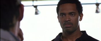 Movie still from “All About the Benjamins” (2002), directed by Kevin Bray – A person wearing a shirt; Close Up shot, Low angle