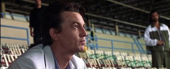 Movie still from “All About the Benjamins” (2002), directed by Kevin Bray – A person wearing a white jacket; Close Up shot, Low angle