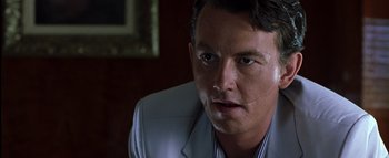 Movie still from “All About the Benjamins” (2002), directed by Kevin Bray – A person wearing a suit and tie; Close Up shot, Low angle