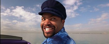 Movie still from “All About the Benjamins” (2002), directed by Kevin Bray – A man wearing a blue shirt and a hat; Close Up shot, Low angle