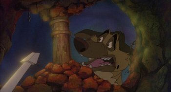 Movie still from “All Dogs Go to Heaven” (1989), directed by Dan Kuenster – A dog's face in a cave; Medium shot, High angle
