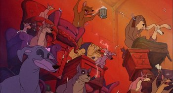 Movie still from “All Dogs Go to Heaven” (1989), directed by Dan Kuenster – A group of cartoon dogs sitting in a room; Wide shot, High angle