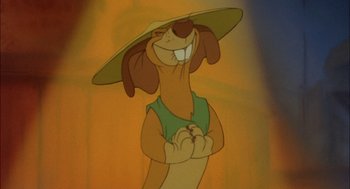 Movie still from “All Dogs Go to Heaven” (1989), directed by Dan Kuenster – A cartoon dog wearing a hat and smiling for the camera; Close Up shot, Low angle