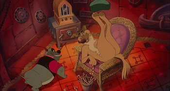 Movie still from “All Dogs Go to Heaven” (1989), directed by Dan Kuenster – A dog laying on its back on a chair; Wide shot, High angle