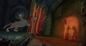 Movie still from “All Dogs Go to Heaven” (1989), directed by Dan Kuenster – An animated scene of a man running through a tunnel; Wide shot, High angle