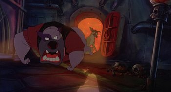 Movie still from “All Dogs Go to Heaven” (1989), directed by Dan Kuenster – A dog and a bear are in a tunnel; Wide shot, Low angle