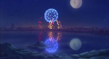 Movie still from “All Dogs Go to Heaven” (1989), directed by Dan Kuenster – Fireworks are reflected in the water of a lake at night; Extreme Wide shot, Low angle